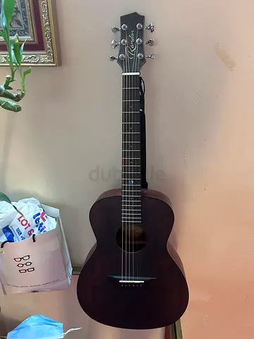 Used dark wood acoustic guitar - mint condition