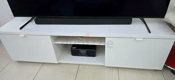 White low TV cabinet with storage shelves and sliding doors