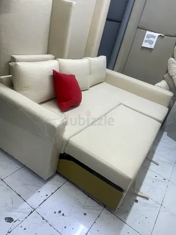Light beige fabric sofa bed with storage - good condition