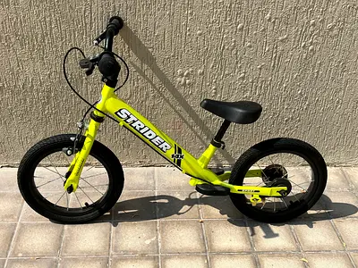 Strider balance bike for kids - lightweight, neon yellow - never used, like new