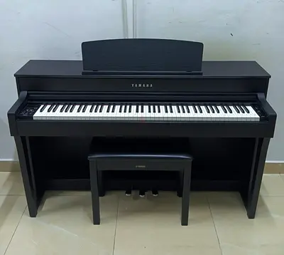 The Yamaha Clavinova CLP-645B is a high-quality 88-key digital piano in a matte black finish