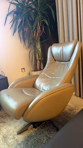 Comfortable leather swivel recliner chair in good condition