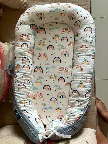 Baby nest lounger / portable newborn sleeper with rainbow print