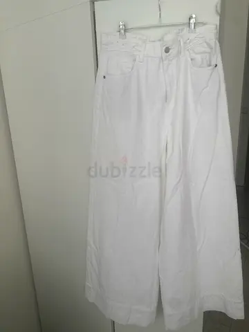White wide-leg women's jeans, size unknown, gently used