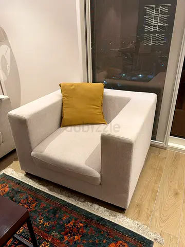 Modern single-seater beige sofa chair - good condition
