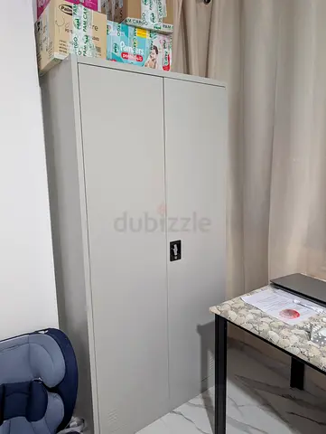 Tall metal storage cabinet with lockable doors - light grey