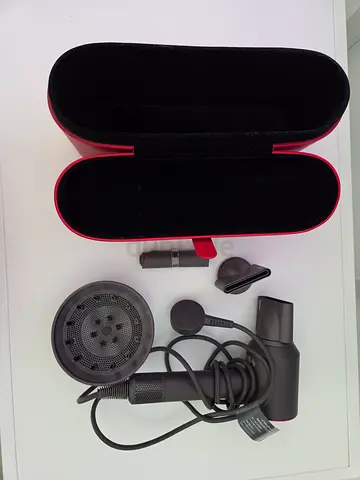 Dyson Supersonic hair dryer with attachments and travel case - light used. Perfect condition.