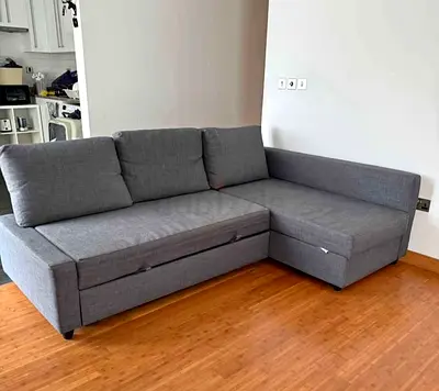 Grey L-shaped Sofa with Storage and Pull-out Bed - Good Condition
