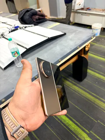 Used smartphone with large circular rear camera module - good condition