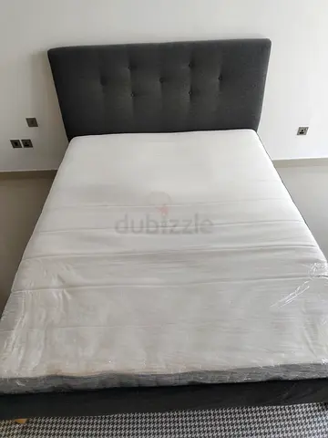 Ikea queen size bed frame with Ikea mattress - grey upholstered headboard