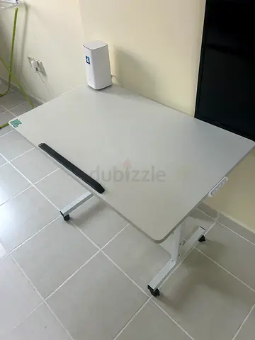 Adjustable white study/office table with folding legs