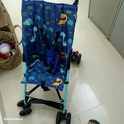 Lightweight blue umbrella stroller with dinosaur print - good condition
