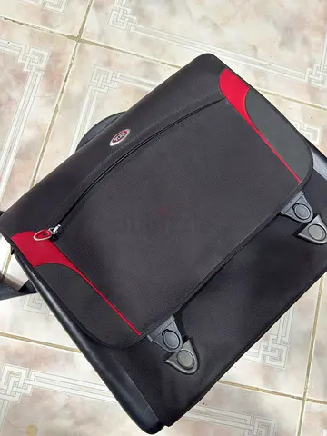 TUMI Black and red travel BRIEFCASE OR LAPTOP BAG in good condition