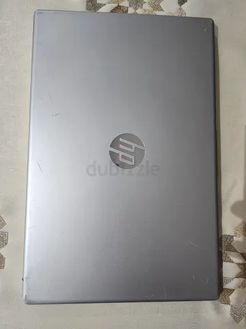 HP Silver Laptop (Used) — Light Scratches on Lid, Working