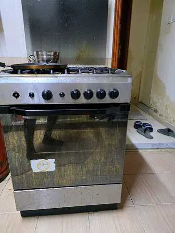 Gas stove with electric ignition and grill