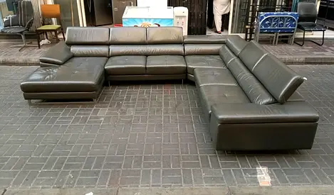 Large L-shaped leather sectional sofa in dark gray - good used condition