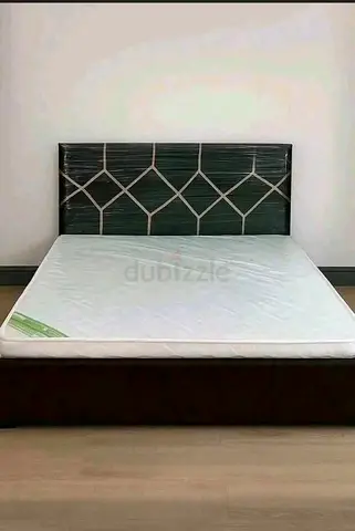 Queen bed frame with mattress - dark wood headboard