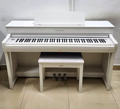 The Yamaha CLP-745WH features a clean satin-white finish and combines a GrandTouch-S™ wooden-key