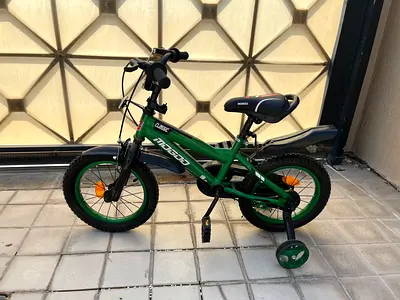 Green kids' 14" Mazzo bike with training wheels - Never used —Like New condition