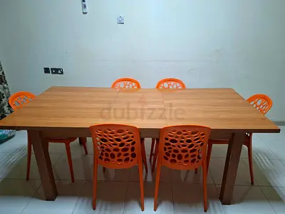 Expandable dining table with chair