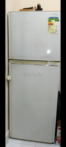 Used double-door refrigerator - working, good for spare room