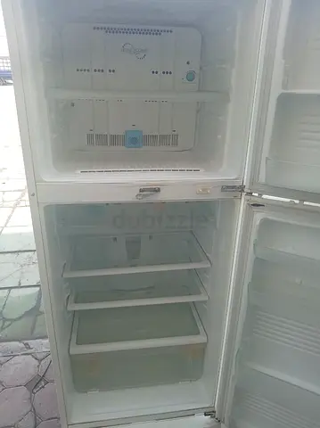 Used double-door refrigerator - working condition, needs minor cleaning