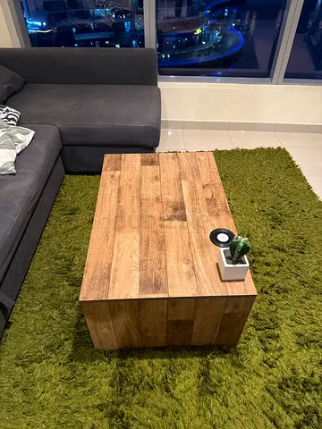 Solid wood-style coffee table with storage - good condition