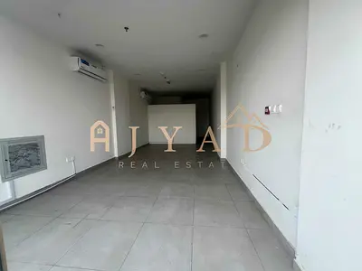 Brand New Shop for Annual Rent in Al Alia, Ajman, 900 Sq Ft, Bathroom, Split AC, Main Road, Near Dubai & Sharjah Exits, Suitable for All Commercial Ac