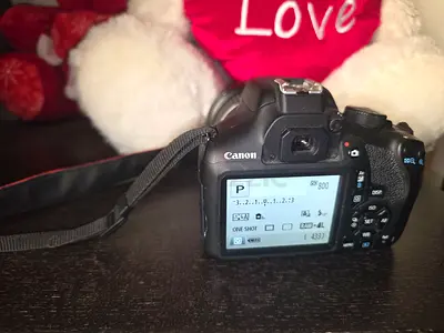 Canon DSLR camera with charger and memory card- good condition