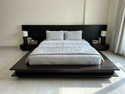 Low platform king bed frame with integrated nightstands - dark wood