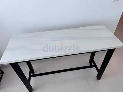 Modern white marble-top console table with black metal frame