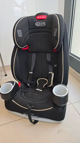 Graco convertible almost new child car seat plus new booster seat — cup holders included