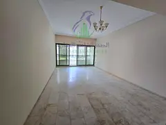 Spacious 3-bedroom apartment in Al Mamzar with a living room, 3 bathrooms, a balcony, and built-in w