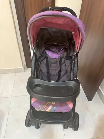 Lightweight purple baby stroller in good condition