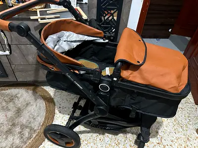 Well-kept brown & black pram stroller - single seat, reversible handle