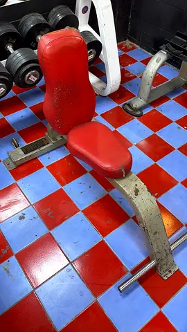 Adjustable weight bench with red padding — sturdy gym bench
