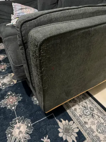 Used dark grey fabric sofa with visible wear and pet damage! Homes R Us brand! 2 Nos Available!!!