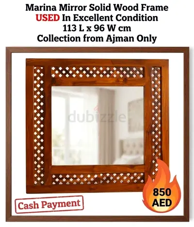 Marina mirror framed by solid wood