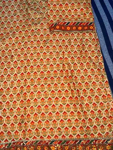 Printed gold embossed dress - yellow with red & orange floral pattern