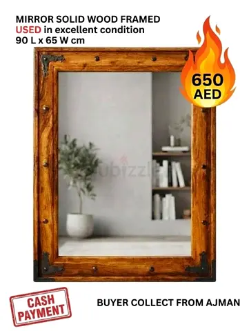 Antique mirror framed by solid wood