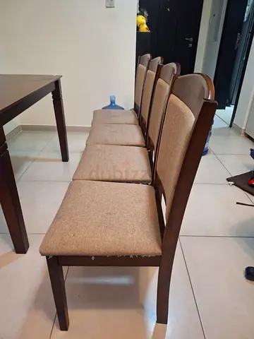 Set of 4 wooden dining chairs with beige fabric seats - good condition