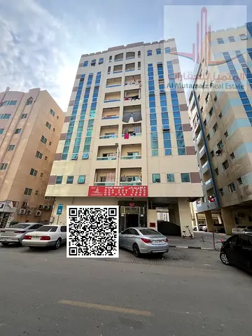 2-bedroom apartment for AED 30,000 yearly, with central AC, landlord-covered maintenance and flexible payments near Kuwait Street