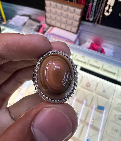 Silver ring with large oval brown agate cabochon — handmade style