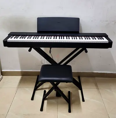 The Yamaha P225B is an 88-key compact, portable digital piano featuring a black finish, weighted