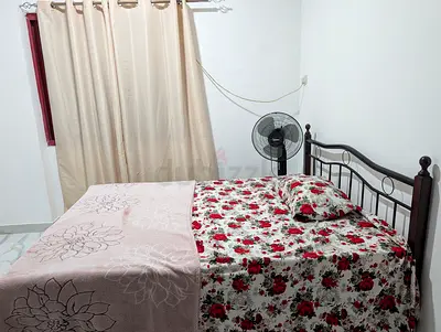 Metal Frame Double Bed with Floral Bedding - Good Condition