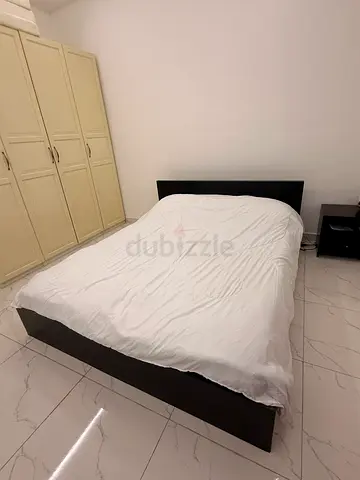 King-size platform bed frame with headboard — good condition