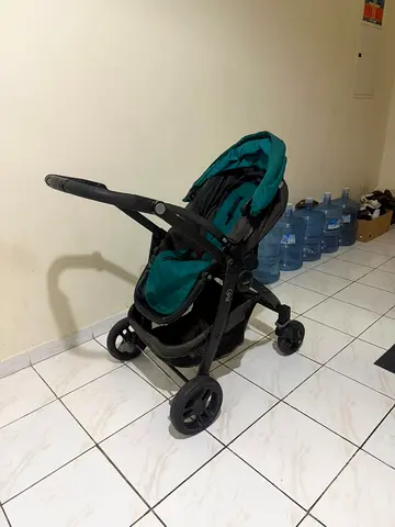 Used single baby stroller - good condition, teal/black