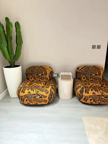 Pair of low lounge floor chairs with patterned upholstery 2 pieces