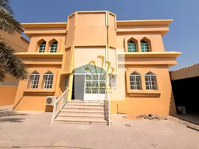 A spacious villa for annual rent in the Al Muwaihat 3 area of Ajman, suitable for corporate housing or large families. It features 7 rooms, two livi