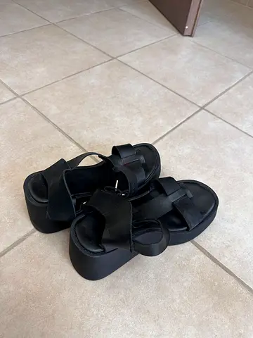 Black platform sandals, size likely women's — worn lightly